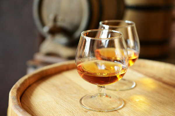 Glasses of brandy in cellar