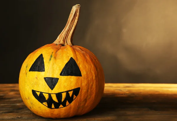 Halloween pumpkin on wooden table — Stock Photo, Image