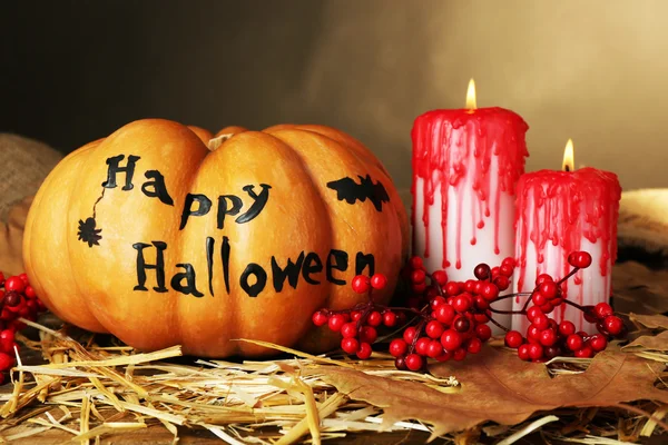 Halloween pumpkin and bloody candles — Stock Photo, Image