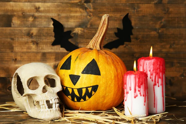 Halloween pumpkin and bloody candles — Stock Photo, Image