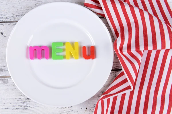 Inscription menu on plate on table close-up — Stock Photo, Image