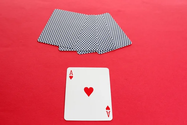 Playing cards on red background — Stock Photo, Image