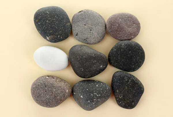 Sea stones on beige background — Stock Photo, Image