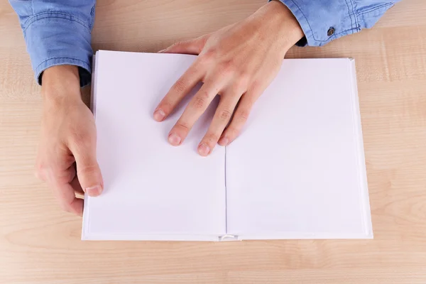 Man reading blank opened book — Stock Photo, Image