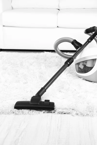 Vacuum cleaner on carpet — Stock Photo, Image