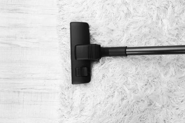 Vacuum cleaner on carpet — Stock Photo, Image