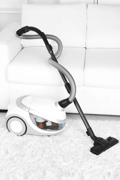 Vacuum cleaner on carpet — Stock Photo, Image