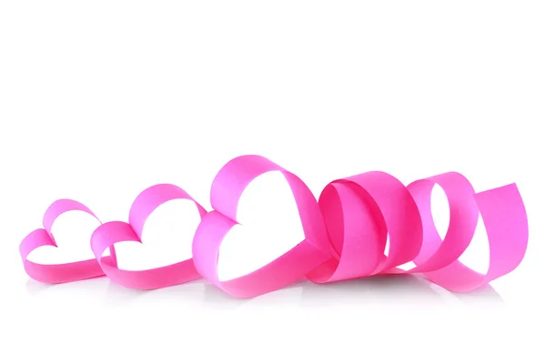 Heart shaped pink paper ribbon isolated on white — Stock Photo, Image