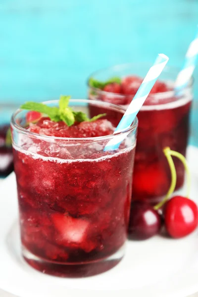 Closeup of cherry granita in glasses, on color wooden background — Stock Photo, Image