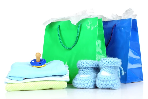 Ropa de bebé y bolsas de regalo — Foto de Stock