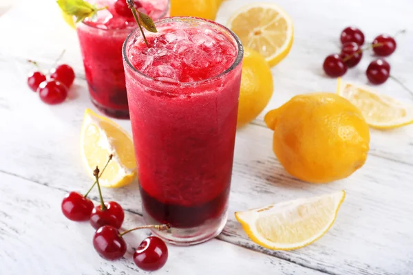 Fresh cold cherry cocktail with mint, ice and lemon — Stock Photo, Image