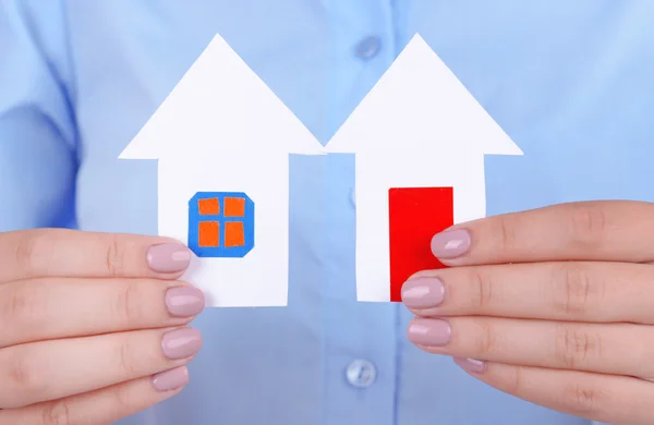 Woman hands holding paper houses close up — Stock Photo, Image