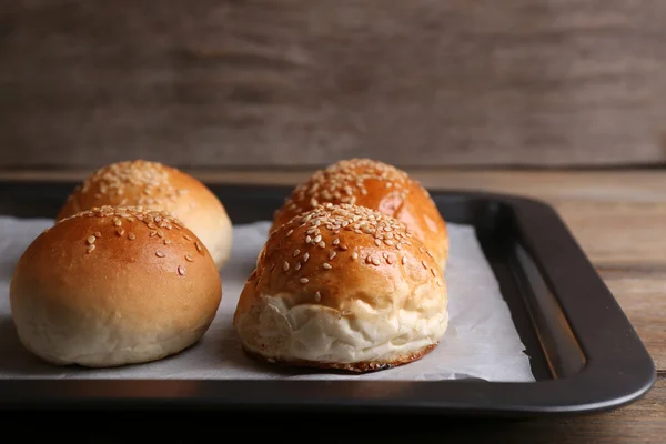 Tasty buns with sesame — Stock Photo, Image