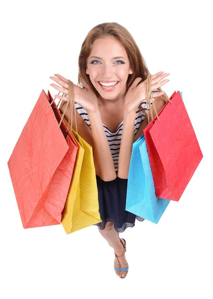 Belle jeune femme avec des sacs à provisions isolés sur blanc — Photo