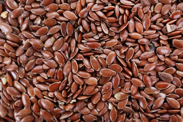 Семена льна в качестве фона — стоковое фото