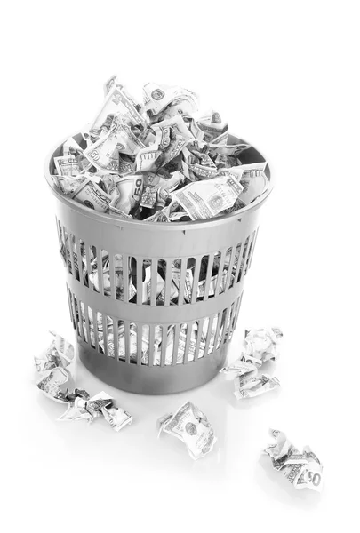 Money in dustbin isolated on white — Stock Photo, Image