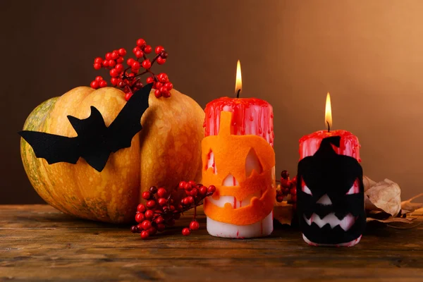 Composition of pumpkin, candle and Halloween decorations — Stock Photo, Image