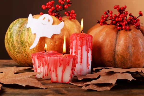 Composition of pumpkin, candle and Halloween decorations — Stock Photo, Image