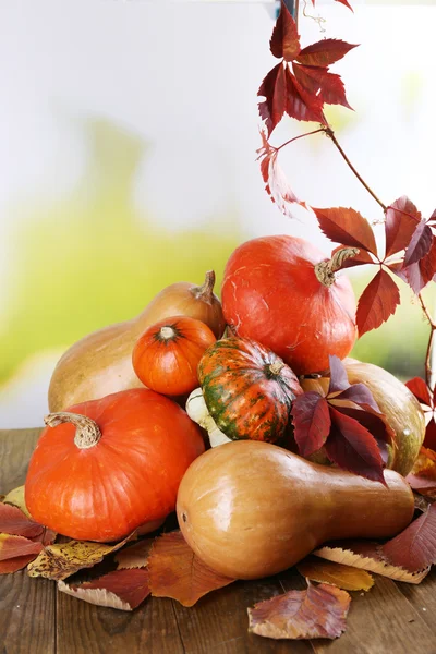 Pumpkins on wooden table — Stock Photo, Image