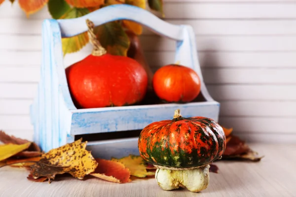 Pumpkins in wooden box — Stock Photo, Image
