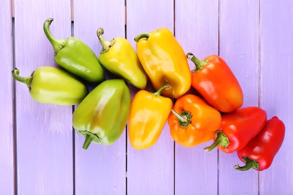 Pepper on wooden background — Stock Photo, Image