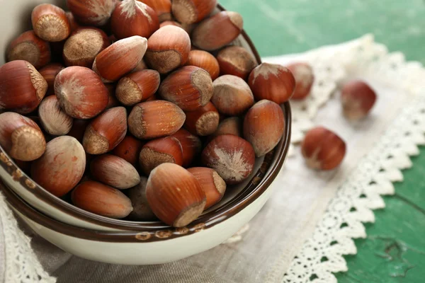 Hazelnuts on plate on napkin — Stock Photo, Image