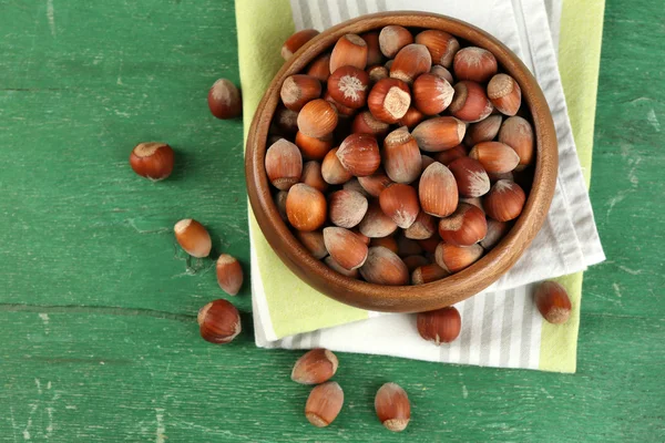 Hazelnuts in wooden bowl — Stock Photo, Image