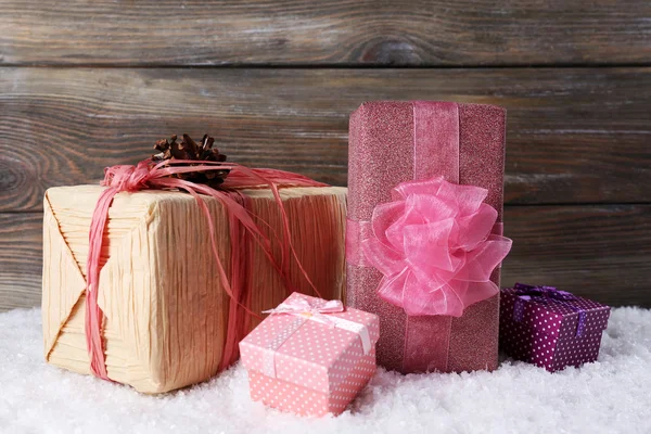 Gift boxes on wooden background — Stock Photo, Image