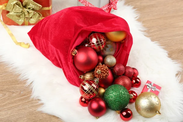 Red bag with Christmas toys — Stock Photo, Image