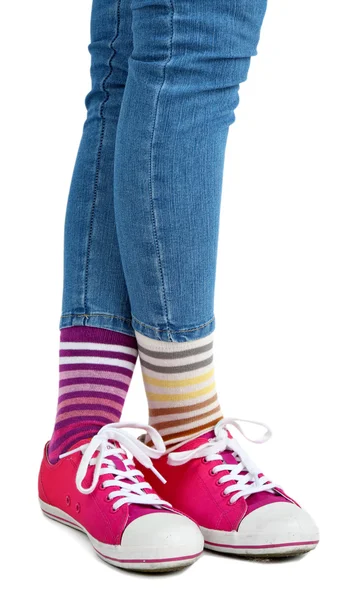 Female legs in socks and sneakers — Stock Photo, Image