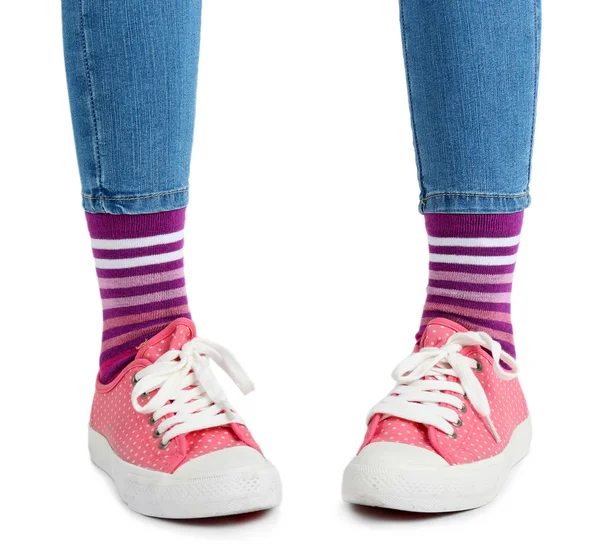 Female legs in socks and sneakers — Stock Photo, Image