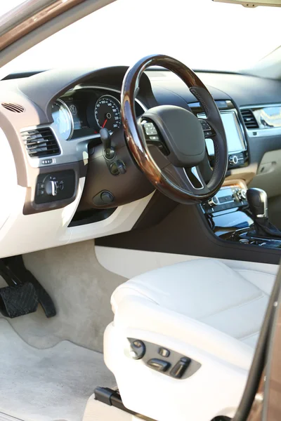 Interior view of car with beige salon and black dashboard — Stock Photo, Image