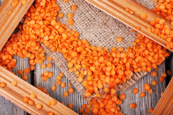 Lentil on sackcloth background — Stock Photo, Image