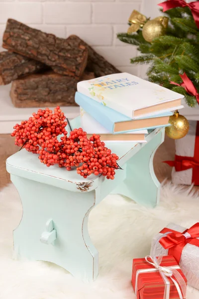 Christmas composition near fireplace in room — Stock Photo, Image