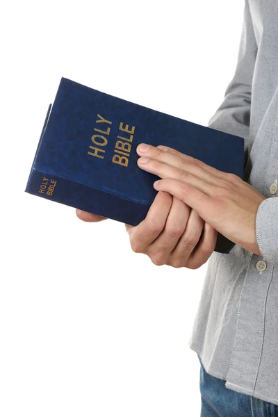 Man holding Bible isolated on white — Stock Photo, Image