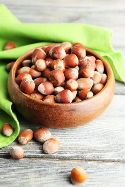 Hazelnuts in wooden bowl — Stock Photo, Image