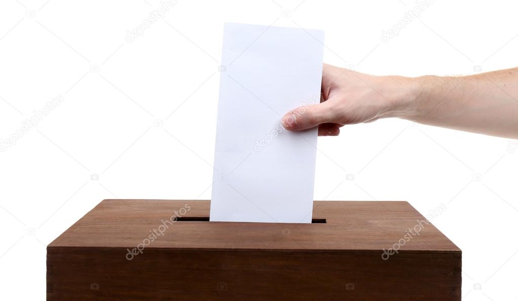 Human hand inserting envelope