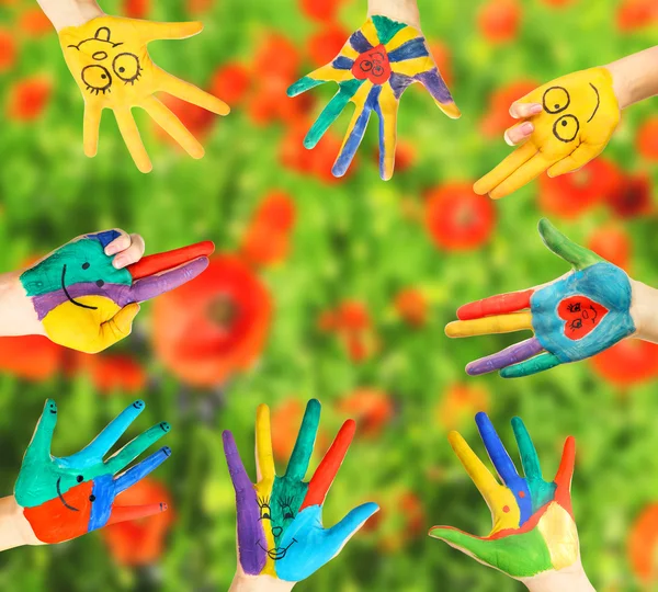 Painted hands on bright background — Stock Photo, Image