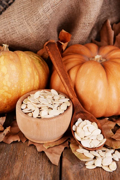 Pumpkin seeds in bowl — Stock Photo, Image