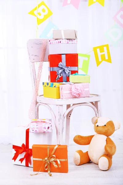 Many birthday gifts in room — Stock Photo, Image