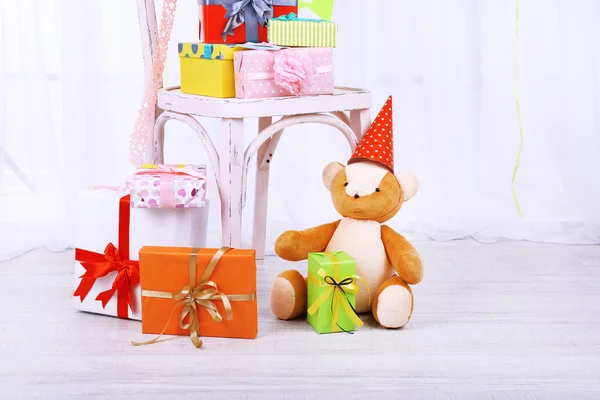 Many birthday gifts in room — Stock Photo, Image