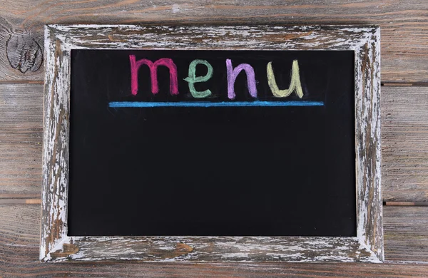 Inscription menu on chalkboard on table close-up — Stock Photo, Image