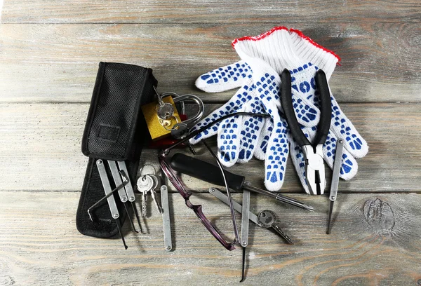 Tools of picking locks on wooden table — Stock Photo, Image