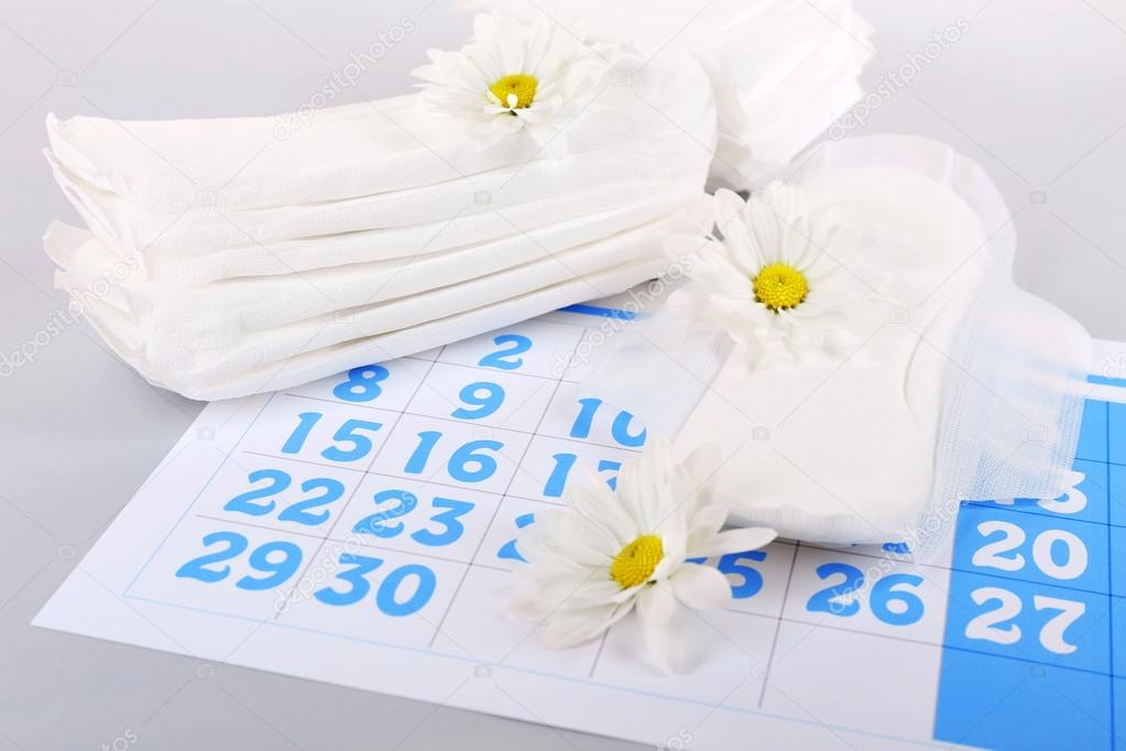 Sanitary pads and white flowers