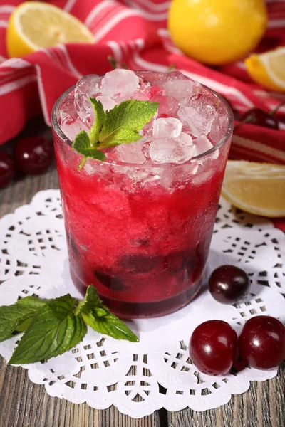 Cherry cocktail with mint, ice and lemon — Stock Photo, Image
