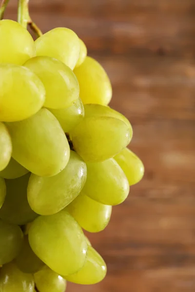 Bunch of grape on wooden background — Stock Photo, Image