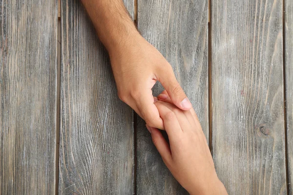 Loving couple holding hands — Stock Photo, Image