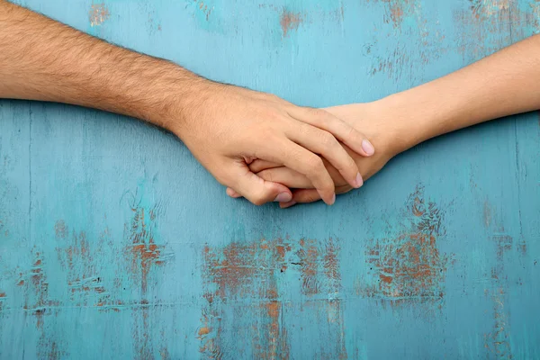 Loving couple holding hands