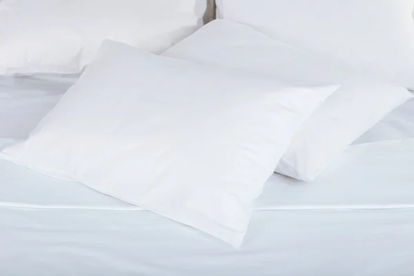 White pillows on bed — Stock Photo, Image