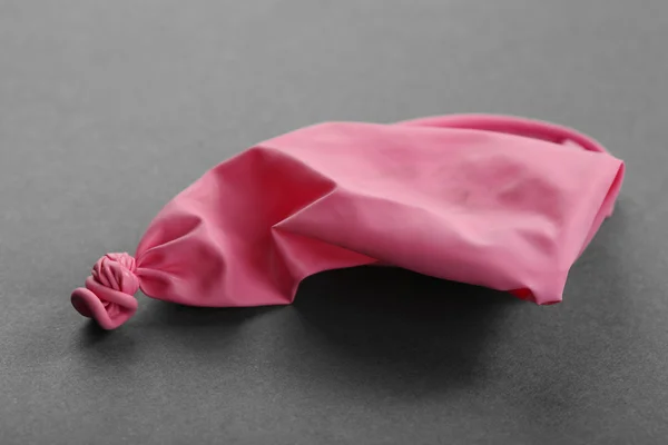 Popped pink balloon — Stock Photo, Image
